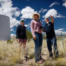 Jerrold Baca, Morgan Vigil and Esther Showalter overlook the Santa Clara Pueblo. 2019.